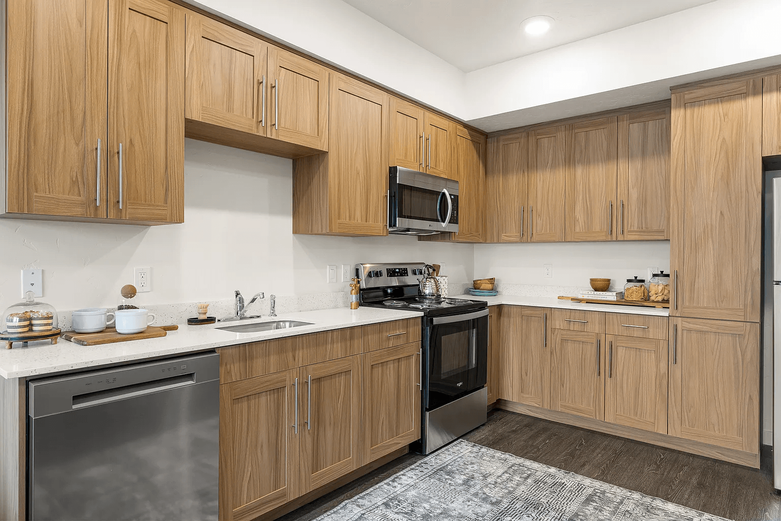 A kitchen with wooden cabinets and stainless steel appliances.